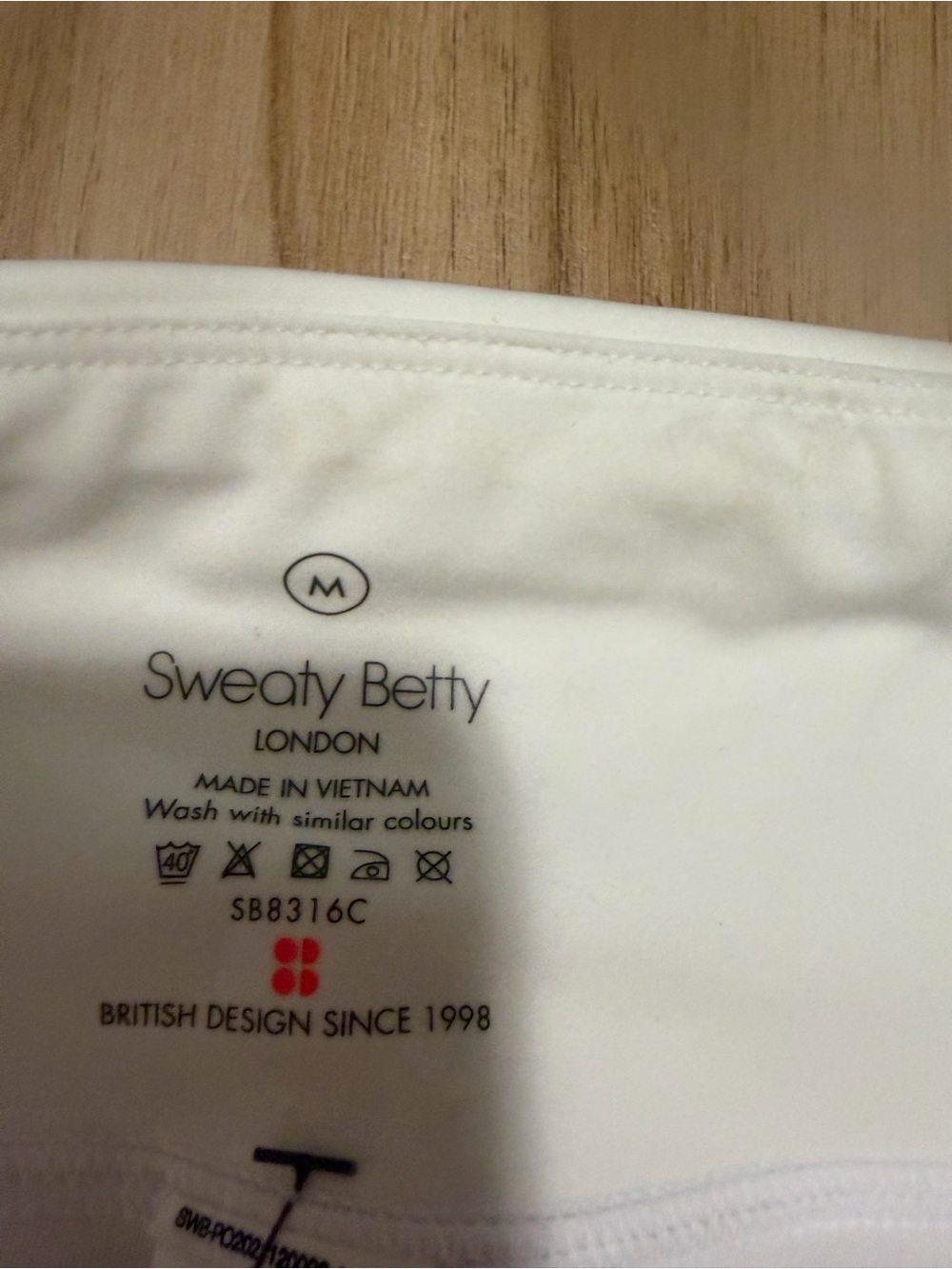 Sweaty Betty White Athletic Shorts with Pink and Yellow Accents - Picture 4 of 5